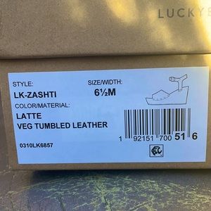 Brand new. Beautiful rust brown color is perfect for a California fall!